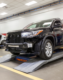 Toyota on vehicle lift | Woodrum Toyota of Macomb in Macomb IL
