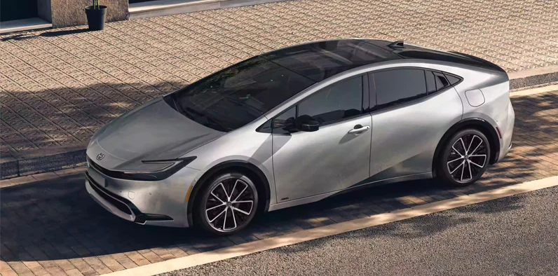 A silver 2024 Toyota Prius parked on the side of the road