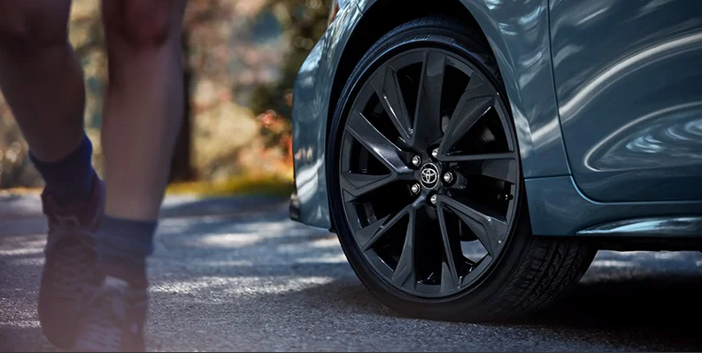 A close up of the drivers side tire of a 2025 Toyota Corolla.