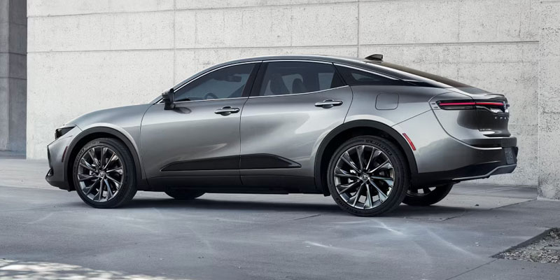 A sleek and modern side view of a 2026 Toyota Crown sedan, showcasing its stylish design and alloy wheels.