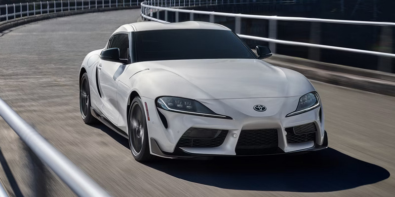 New 2026 Toyota GR Supra cruising on bridge