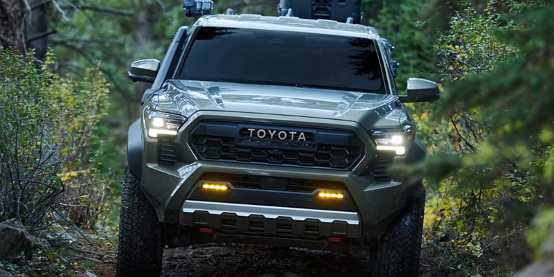 2026 Toyota Tacoma showing it's off-road capabilities in the forest